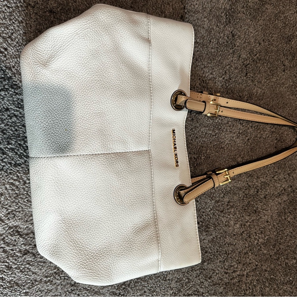 White Michael Kors purse. Does have some spots that need to be cleaned